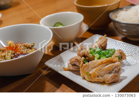 A Japanese-style dinner of teriyaki chicken, simmered eggplant, and a side dish of cucumber A Japanese-style dinner of teriyaki chicken, simmered eggplant, and a side dish of cucumber 130073063