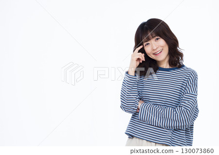 Woman thinking with a smile 130073860