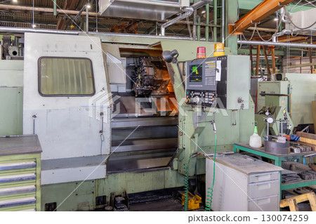 A factory lined with machine tools A factory lined with machine tools 130074259