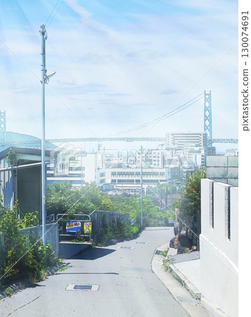 Akashi Kaikyo Bridge and cityscape from near Sanyo Electric Railway Higashi-Tarumi Station [Vertical composition] 130074691