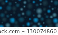 Dark abstract background with glowing blue bokeh circles and noise texture creates dreamy blurred pattern. 130074860