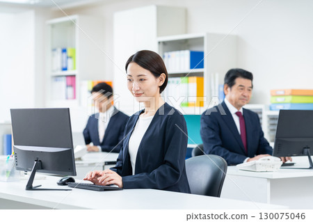 Middle business woman working in the office 130075046