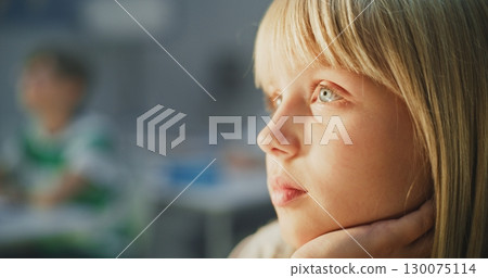 Close Up Shot of Focused Young Girl Listening to Interesting Lecture 130075114