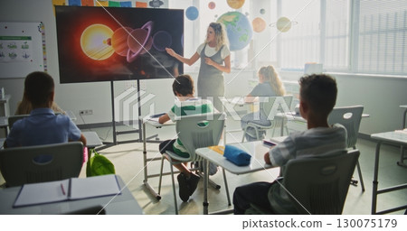Elementary School Students Studying Basic Information About Solar System and Planets Elementary School Students Studying Basic Information About Solar System and Planets 130075179