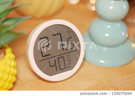 Temperature and humidity display on a wooden table Temperature and humidity display on a wooden table 130075684