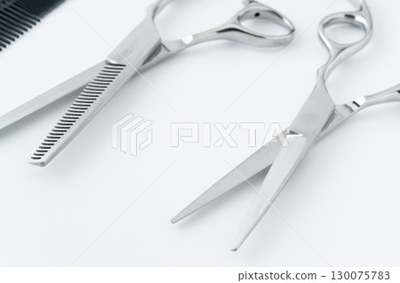 Close-up of the cutting edges of haircutting scissors and thinning shears 130075783