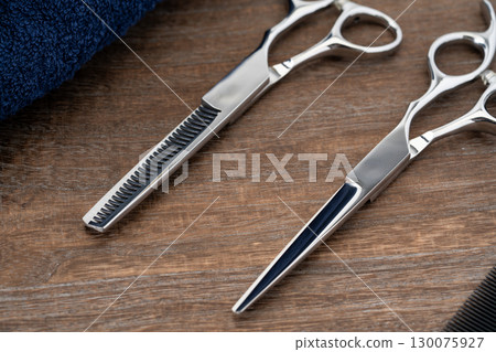Close-up of haircutting scissors and thinning shears Close-up of haircutting scissors and thinning shears 130075927
