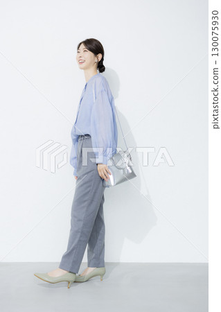 Young woman wearing a light blue shirt Young woman wearing a light blue shirt 130075930