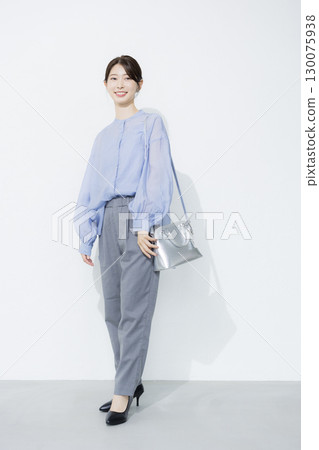 Young woman wearing a light blue shirt Young woman wearing a light blue shirt 130075938