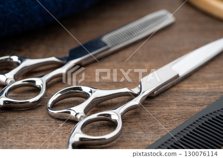 Close-up of haircutting scissors and thinning shears Close-up of haircutting scissors and thinning shears 130076114