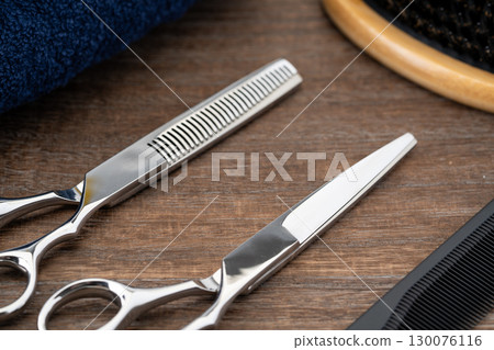 Close-up of haircutting scissors and thinning shears Close-up of haircutting scissors and thinning shears 130076116