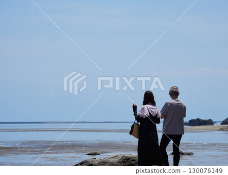 Coastal scenery and tourists on Amaharashi Coast in Toyama Bay in summer 130076149