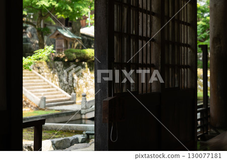 Landscape with lattice door 130077181