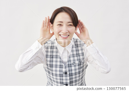 Female office worker listening gesture white background Female office worker listening gesture white background 130077565