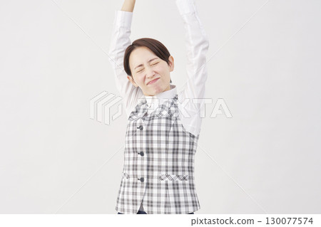 Female office worker stretching stretching white background Female office worker stretching stretching white background 130077574