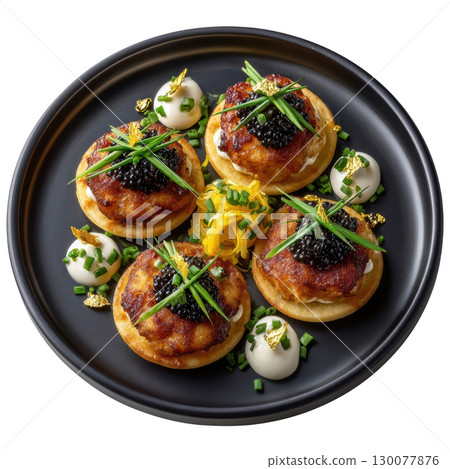 Exquisite Presentation of Beluga Caviar on Fluffy Buckwheat Blinis with Cream Fraiche and Fresh Chives 130077876