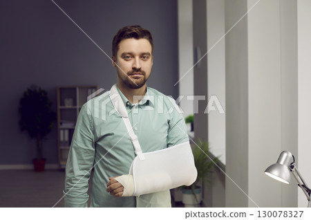 Young man with broken arm wearing arm splint Young man with broken arm wearing arm splint 130078327