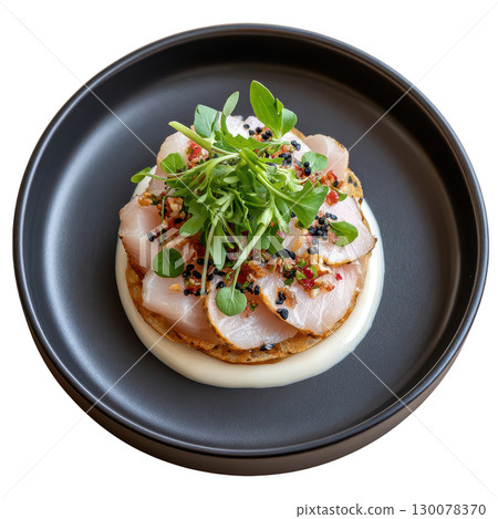 Delicate Amberjack Sashimi with Yuzu Truffle Dressing and Micro Yuzu Leaves Artfully Arranged on a Plate 130078370