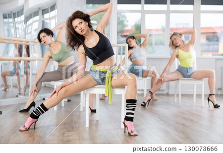Group of women doing high heels dance class Group of women doing high heels dance class 130078666