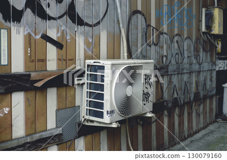 Electrical equipment and air conditioner outdoor units covered in stickers and graffiti 130079160