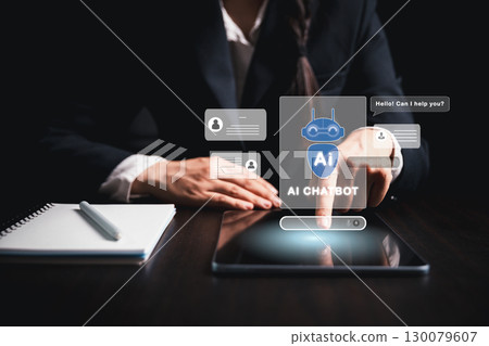 Businesswoman uses chatbot powered by AI technology and artificial intelligence to chat and converse with smart robot system analyzes data to help solve work-related problems. AI chatbot concept. 130079607