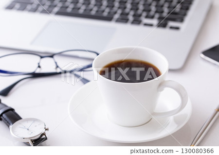 Drinking hot coffee in the office Drinking hot coffee in the office 130080366