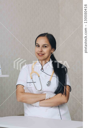 readiness to address patient needs, highlighted by her confident stance readiness to address patient needs, highlighted by her confident stance 130080416