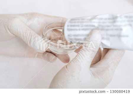 careful preparation of materials for a cosmetic procedure, demonstrating the blend of science and art in dermatology careful preparation of materials for a cosmetic procedure, demonstrating the blend of science and art in dermatology 130080419