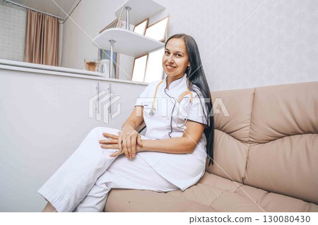 confidence and professionalism of the medical professional, stethoscope around her neck 130080430