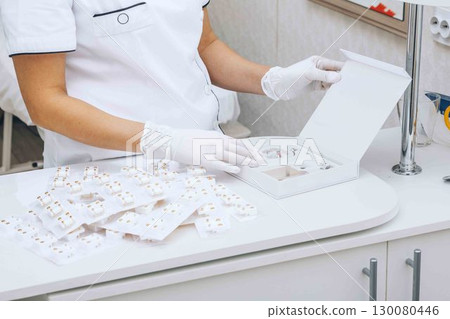 careful organization of earrings, ensuring each pair is sterile and ready for use 130080446