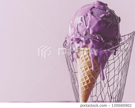 Creamy purple ice cream melting in a waffle cone against a pastel background 130080902