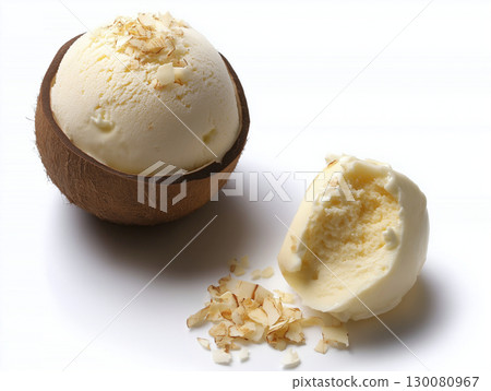Delicious coconut ice cream served in a natural coconut shell with toppings 130080967