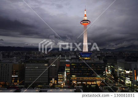 Kyoto Tower photographed from Kyoto Station Building on a cloudy evening Kyoto Tower photographed from Kyoto Station Building on a cloudy evening 130081031