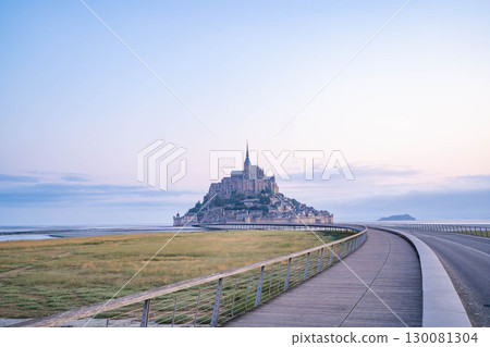 Panoramic view of Mont Saint-Michel at sunrise (French World Heritage Site) 130081304