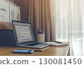 Sleek modern workspace with laptop and notepad for SEO analysis 130081450