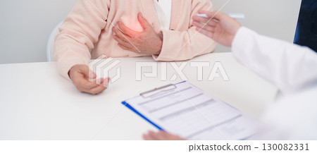 Elderly woman Patient consultation with doctor for Breast Augmentation Surgery, October Breast Cancer Awareness month, implant, Diagnosis, Beauty woman enlargement and medical healthcare concept 130082331