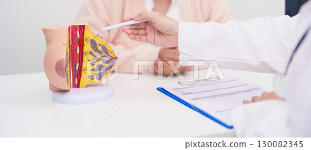Elderly woman Patient consultation with doctor for Breast Augmentation Surgery, October Breast Cancer Awareness month, implant, Diagnosis, Beauty woman enlargement and medical healthcare concept 130082345