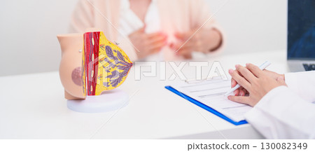 Elderly woman Patient consultation with doctor for Breast Augmentation Surgery, October Breast Cancer Awareness month, implant, Diagnosis, Beauty woman enlargement and medical healthcare concept 130082349