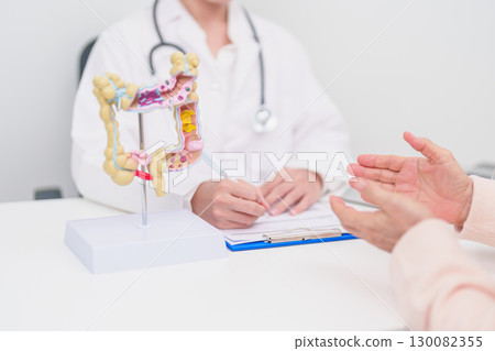 Elderly woman Patient consultation with doctor for Colon disease, Large Intestine, Colorectal cancer, Ulcerative colitis, Diverticulitis, Irritable bowel syndrome, Digestive system and Healthcare 130082355
