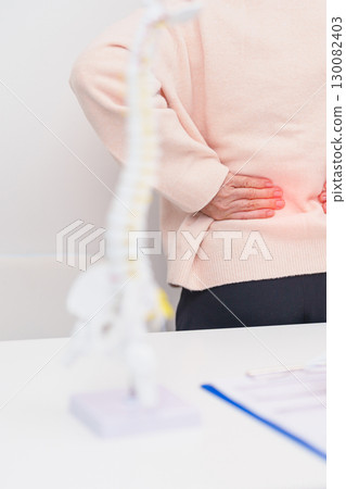 Elderly Patient consulting Doctor with Spine anatomy for Spinal Cord Disorder and disease, Back pain, Lumbar, Sacral pelvis, Cervical neck, Thoracic, Coccyx, Orthopedist, chiropractic, Office Syndrome Elderly Patient consulting Doctor with Spine anatomy for Spinal Cord Disorder and disease, Back pain, Lumbar, Sacral pelvis, Cervical neck, Thoracic, Coccyx, Orthopedist, chiropractic, Office Syndrome 130082403