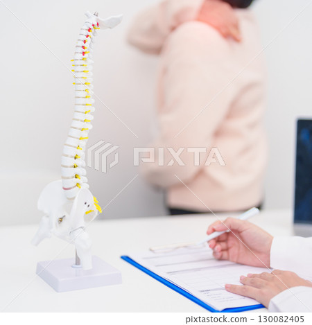 Elderly Patient consulting Doctor with Spine anatomy for Spinal Cord Disorder and disease, Back pain, Lumbar, Sacral pelvis, Cervical neck, Thoracic, Coccyx, Orthopedist, chiropractic, Office Syndrome 130082405