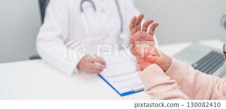 Elderly Patient Woman wrist pain and Consulting doctor. muscle ache from Carpal Tunnel Syndrome, De Quervain s tenosynovitis, rheumatoid, arthritis, gout, Parkinson disease and ergonomic healthcare Elderly Patient Woman wrist pain and Consulting doctor. muscle ache from Carpal Tunnel Syndrome, De Quervain s tenosynovitis, rheumatoid, arthritis, gout, Parkinson disease and ergonomic healthcare 130082410