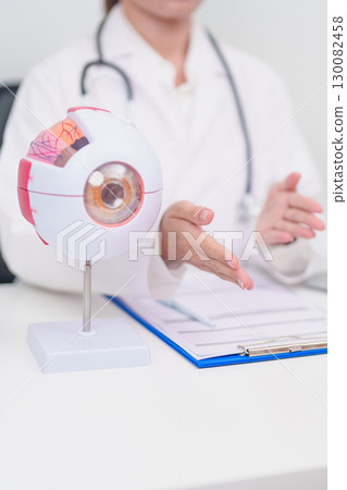 Elderly Patient consulting Doctor to Eye disease, Senior Medical Diagnosis. Anatomy Eye model for Cataract, Glaucoma, Age Related Macular Degeneration, Diabetic Retinopathy, Vitreous, health concept Elderly Patient consulting Doctor to Eye disease, Senior Medical Diagnosis. Anatomy Eye model for Cataract, Glaucoma, Age Related Macular Degeneration, Diabetic Retinopathy, Vitreous, health concept 130082458