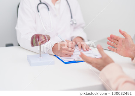 Doctor with human Liver anatomy. Elderly Patient consultation medical health for Liver cancer and Tumor, Jaundice, Viral Hepatitis, Cirrhosis, Failure, Enlarged, Hepatic Encephalopathy, Ascites Fluid 130082491