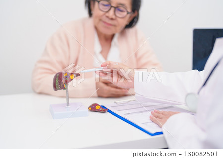 Doctor with human Liver anatomy. Elderly Patient consultation medical health for Liver cancer and Tumor, Jaundice, Viral Hepatitis, Cirrhosis, Failure, Enlarged, Hepatic Encephalopathy, Ascites Fluid 130082501