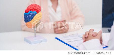 Elderly Patient consulting Doctor to Brain disease, Senior Health Medical Diagnosis. Anatomy Brain model for Explanation, Brain Tumor, neurological disorders, Dementia, alzheimer, parkinson and Mental 130082647