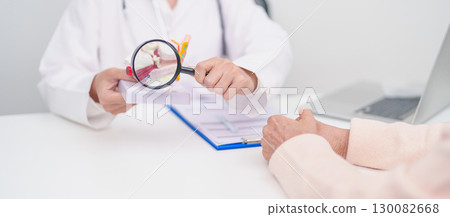 Elderly Patient consulting Doctor to Ear disease. Senior Health Medical Diagnosis. Anatomy Ear model for Atresia, Otitis Media, Pertorated Eardrum, Meniere syndrome, otolaryngologist, Hearing Loss 130082668