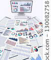 Desktop computer and business documents displaying data 130082758
