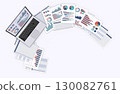 Laptop with data displayed and business documents 130082761