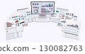 Desktop computer and business documents displaying data 130082763